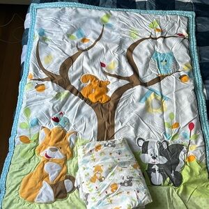 Crib quilt and matching fitted sheet EUC